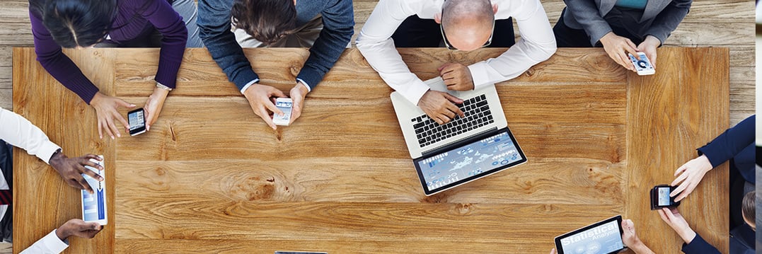 IT Employees Working Together Around The Table