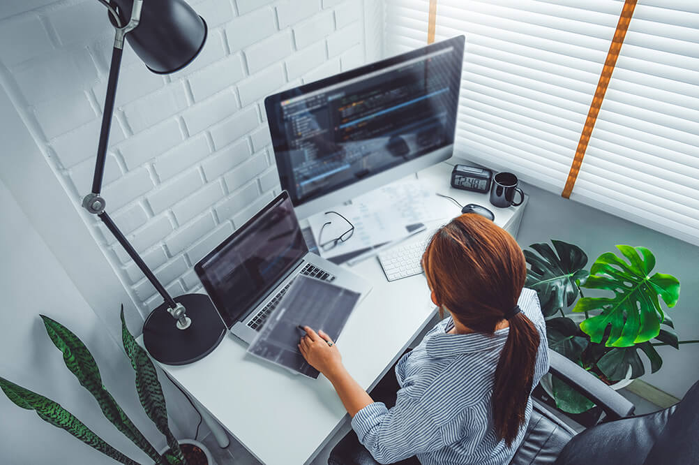 An IT Employee working on their desk