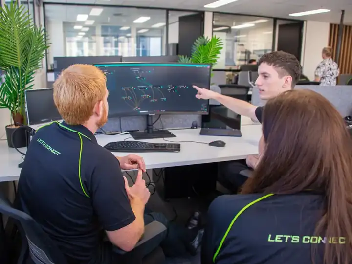 Essential Tech team reviewing systems together